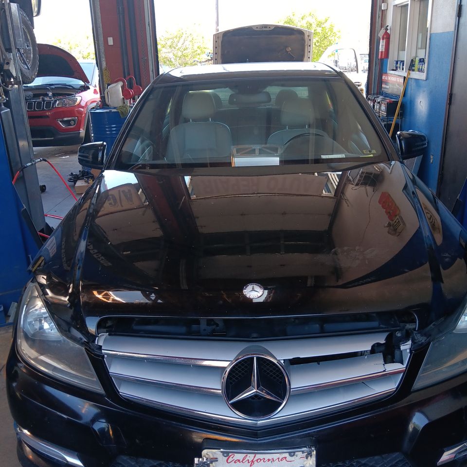 Luxury vehicle being serviced at Johnny's Radiator and Auto Repair